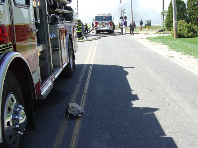 Close Call: Propane Tank BLEVE - 5/1/06 occurred at Schulman's Barn Fire, Depot Lane, Engine 8-5-1 which was supplying water and a piece of the tank are pictured where it landed nearly 1000 feet away.