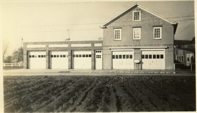 Firehouse with farmfield across the street.